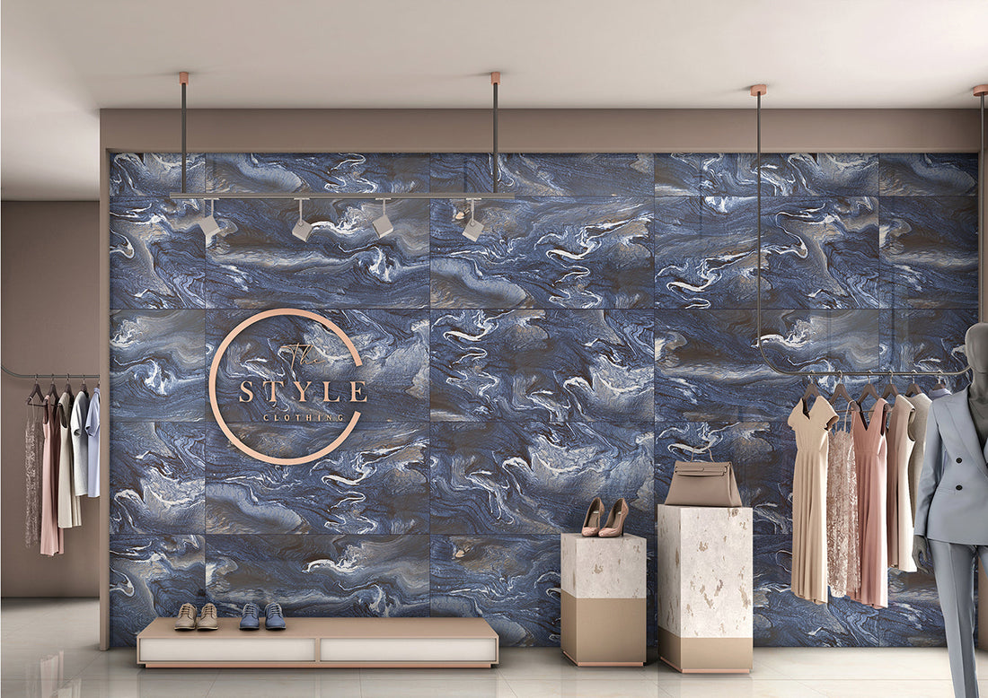 Modern UK bathroom featuring large blue marble effect porcelain tiles with soft white veining, creating a luxurious spa-style interior with minimal grout lines and contemporary lighting.