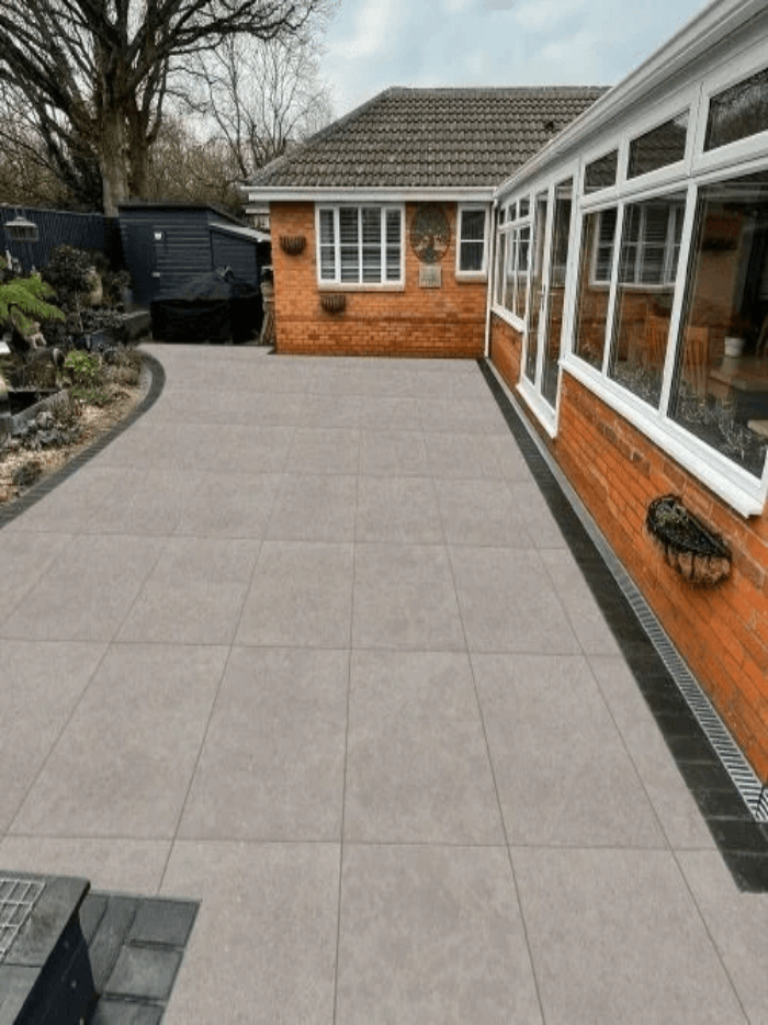 Close-up of R11 anti-slip surface on a grey limestone-effect porcelain outdoor tile.
