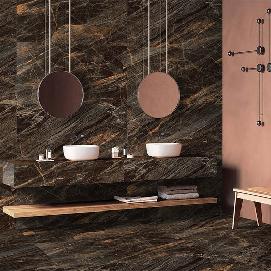 Bathroom with dark marble walls, two white sinks, and a wooden shelf.