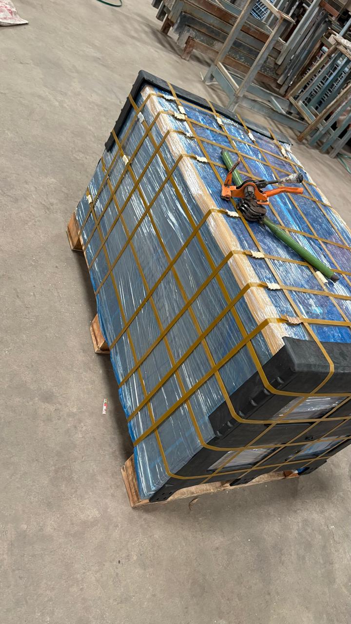 Pallet with stacked boxes on a concrete floor