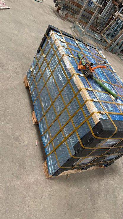 Pallet with stacked boxes on a concrete floor