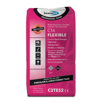 Professional application of CTA flexible grey adhesive on a large format ceramic tile with a notched trowel.